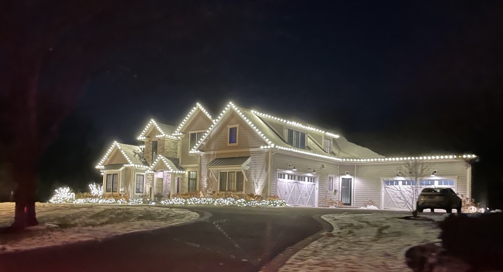 Geneva IL home with warm white roofline and landscape lighting