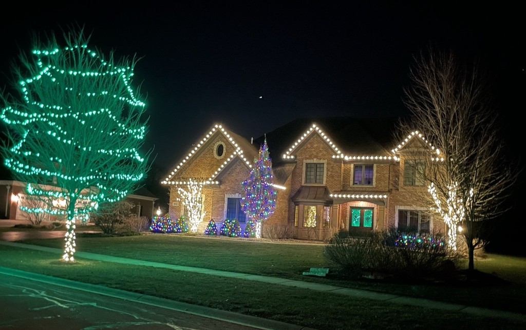 St Charles IL home with green tree wrap and warm white roofline lights